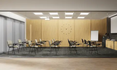 Iso Besucherstuhl mit Tablar im Schulungsraum
